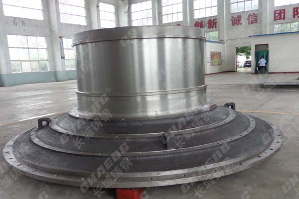 What is the connection between the ball mill end cover and the ball mill cylinder?