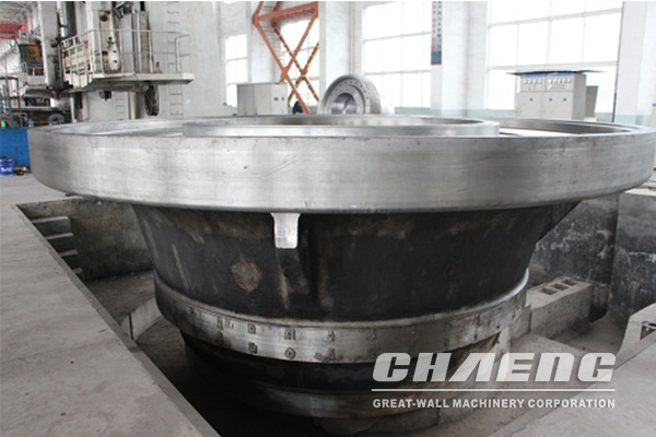 What casting process is used to process the vertical roll mill grinding table?